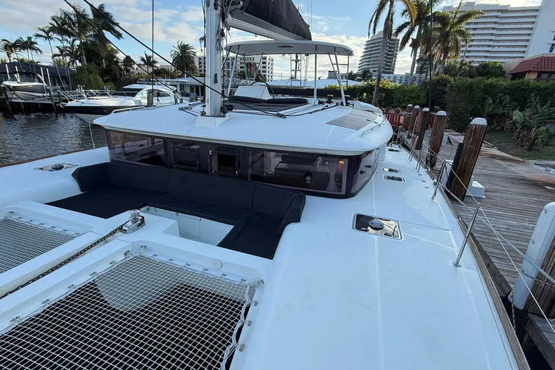 The Image of 2019 Lagoon 450 catamaran docked, featuring spacious deck and modern design. - 0