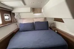 Slide: The Image of Luxurious cabin interior of 2019 Lagoon 450 yacht with cozy bedding. - 19