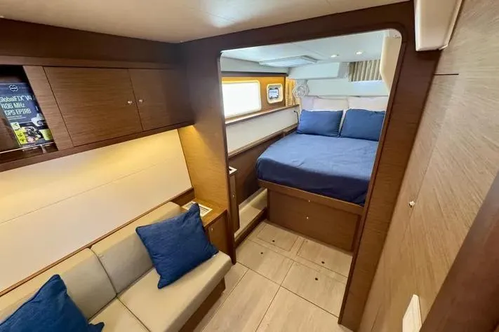 Slide: The Image of Luxurious interior of 2019 Lagoon 450 yacht with cozy bedroom and seating area. - 21