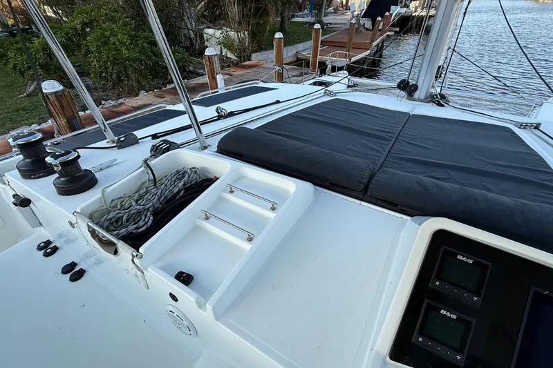 Slide: The Image of 2019 Lagoon 450 catamaran deck with ropes, winches, and navigation instruments. - 3