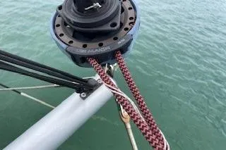 Slide: The Image of Close-up of a 2019 Lagoon 450 sailboat rigging over water. - 38