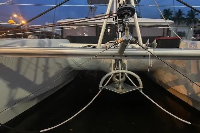 Slide: The Image of Front view of a 2019 Lagoon 450 catamaran at dusk, docked in a marina. - 39