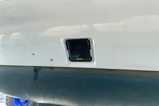 Slide: The Image of 2019 Lagoon 450 yacht hull detail with a small hatch opening. - 44