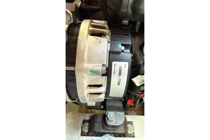 Slide: The Image of Alternator of a 2019 Lagoon 450 yacht, labeled with part number 128990-77260. - 54