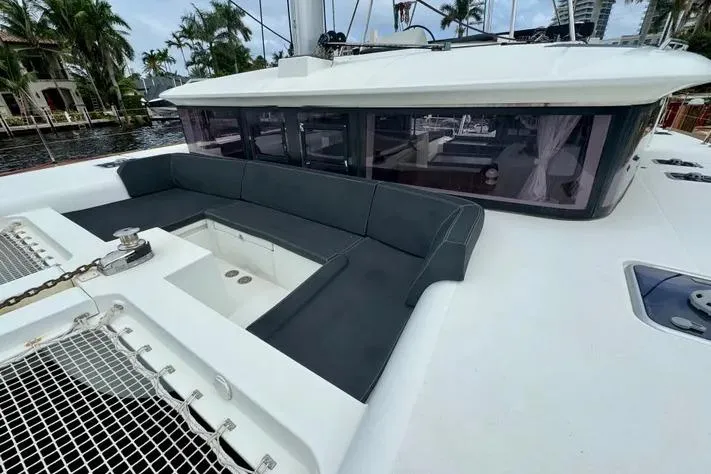 Slide: The Image of Luxurious 2019 Lagoon 450 catamaran with spacious outdoor seating and sleek design. - 6