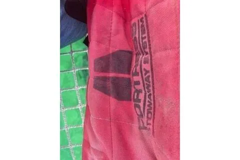 Slide: The Image of Red and green fabric with "Fortress Towaway Series" text, Lagoon 450, 2019 model. - 68