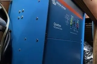 Slide: The Image of Blue Victron Energy Quattro inverter inside a 2019 Lagoon 450 yacht. - 70