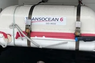 Slide: The Image of Transocean 6 liferaft on Lagoon 450, 2019 model, secured with straps. - 72