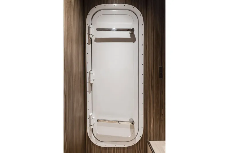 Slide: The Image of White door on Cranchi Settantotto 78 yacht, 2026 model, with wood paneling. - 23