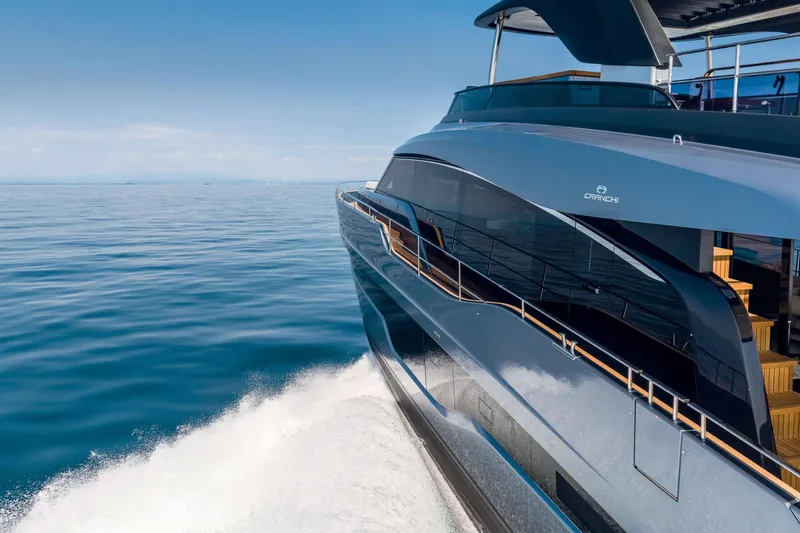 Slide: The Image of 2026 Cranchi Settantotto 78 yacht cruising on open sea, sleek design, luxury vessel. - 3
