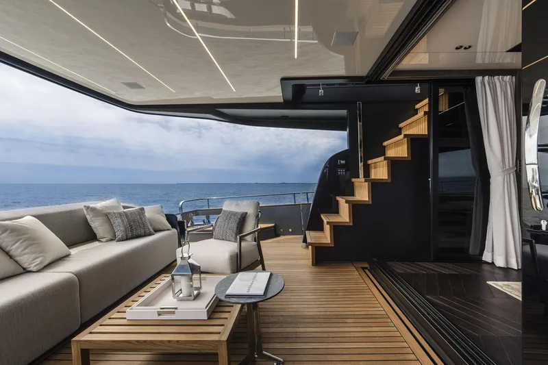 Slide: The Image of Luxurious 2026 Cranchi Settantotto 78 yacht interior with elegant seating and ocean view. - 40