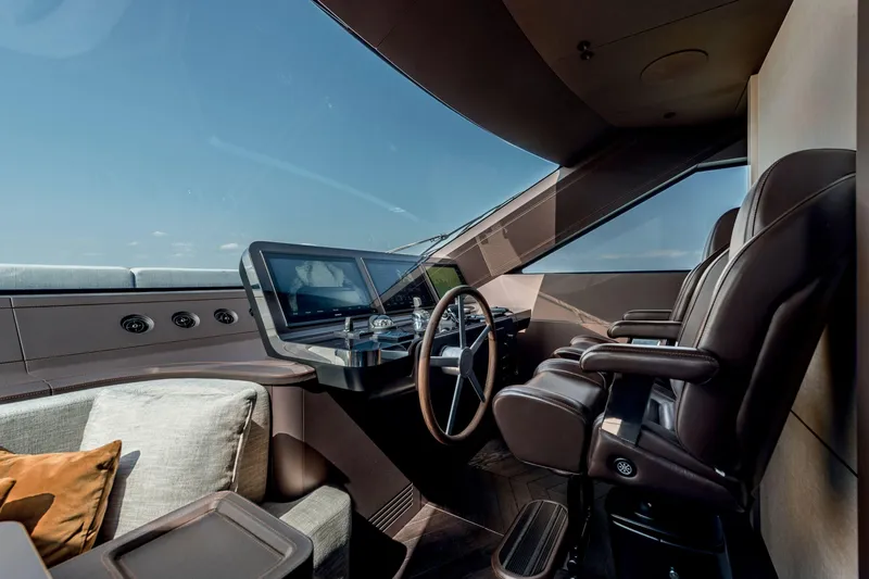 Slide: The Image of Luxurious helm of 2026 Cranchi Settantotto 78 yacht with modern controls and leather seating. - 44