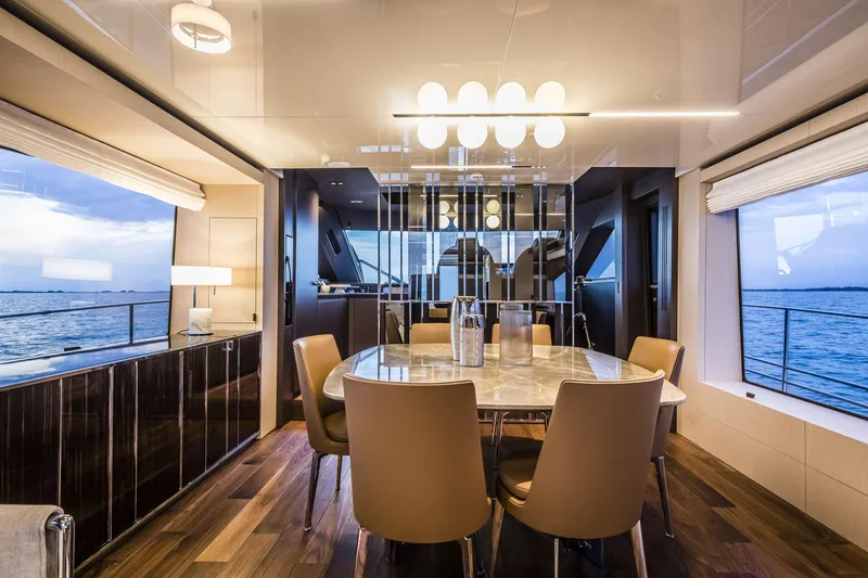 Slide: The Image of Luxurious interior of 2026 Cranchi Sessantasette 67 yacht with elegant dining area and ocean view. - 11