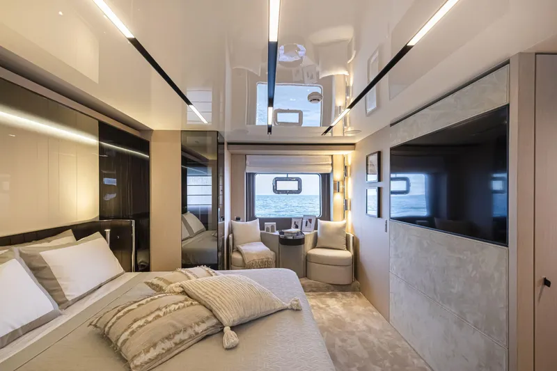 Slide: The Image of Luxurious interior of 2026 Cranchi Sessantasette 67 yacht with elegant bedroom and sea view. - 12