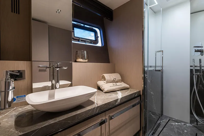 Slide: The Image of Luxurious bathroom in 2026 Cranchi Sessantasette 67 yacht with modern fixtures and elegant design. - 21