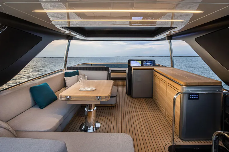 Slide: The Image of Luxurious interior of 2026 Cranchi Sessantasette 67 yacht with elegant seating and ocean view. - 22