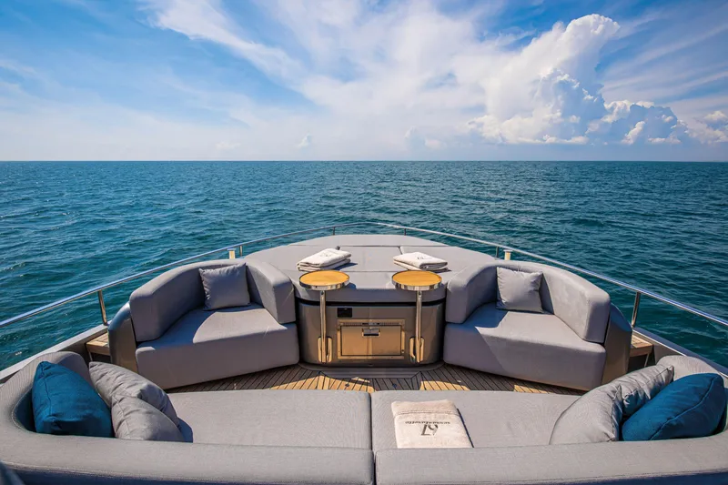 Slide: The Image of Luxurious 2026 Cranchi Sessantasette 67 yacht deck with ocean view and plush seating. - 23