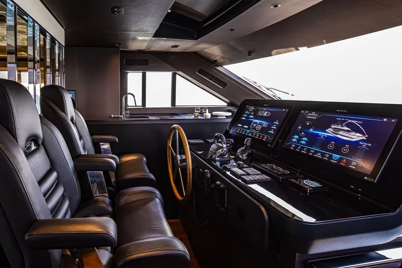 Slide: The Image of Luxurious 2026 Cranchi Sessantasette 67 yacht cockpit with advanced navigation displays and leather seating. - 30
