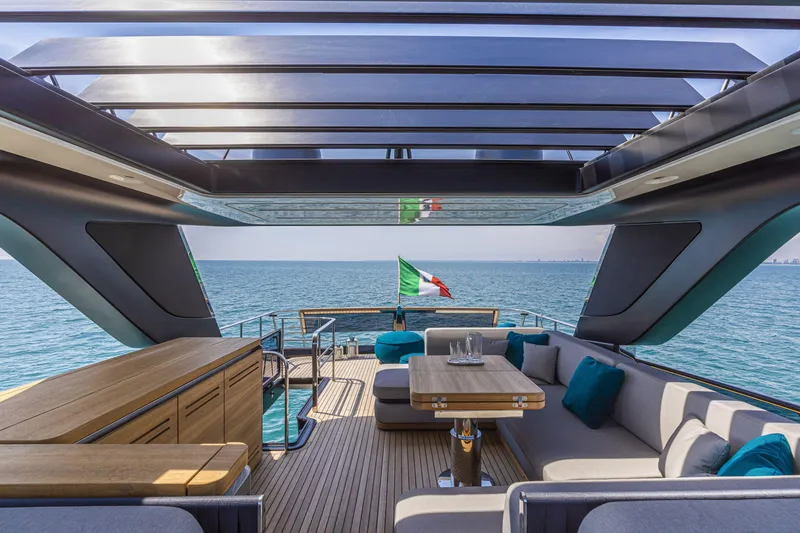Slide: The Image of Luxurious 2026 Cranchi Sessantasette 67 yacht interior with ocean view and elegant seating area. - 33