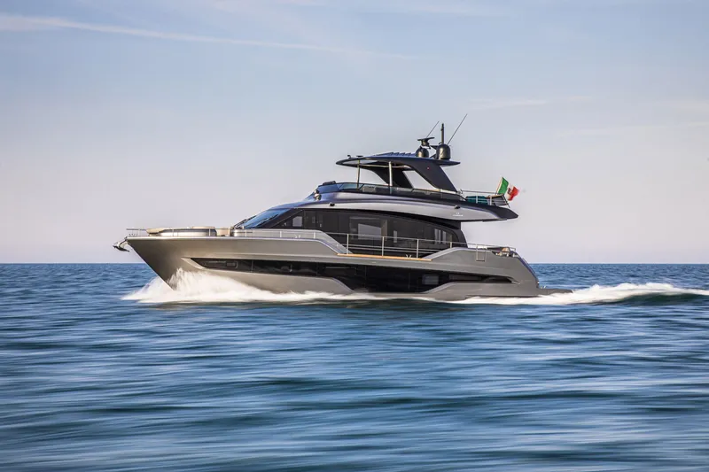 Slide: The Image of 2026 Cranchi Sessantasette 67 yacht cruising on open sea, side view. - 6