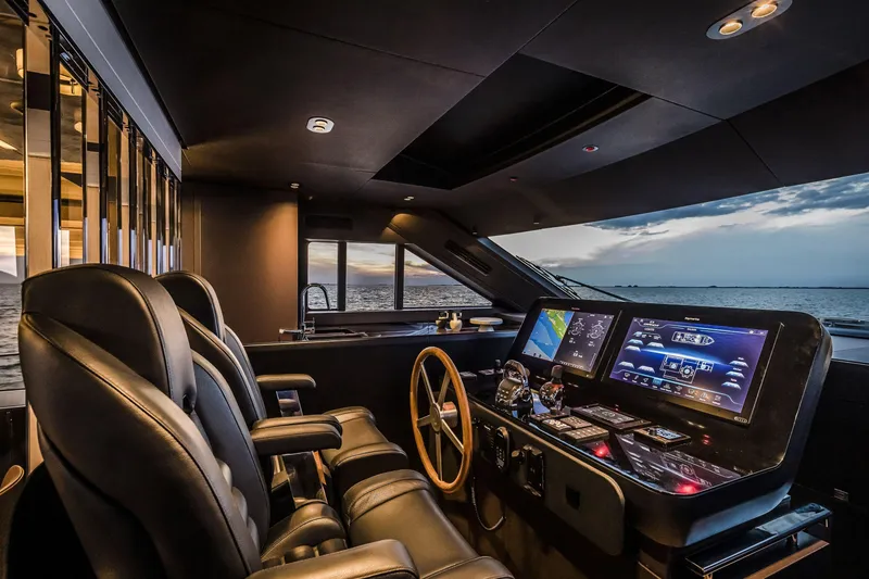 Slide: The Image of Luxurious 2026 Cranchi Sessantasette 67 yacht cockpit with advanced navigation systems and ocean view. - 8
