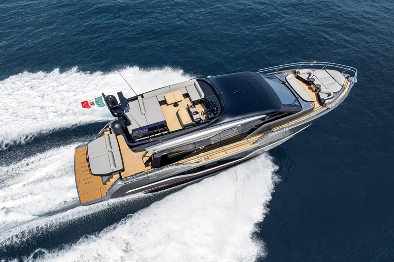 The Image of 2026 Cranchi Sessantasette 67 Corsa yacht cruising on open water, aerial view. - 1