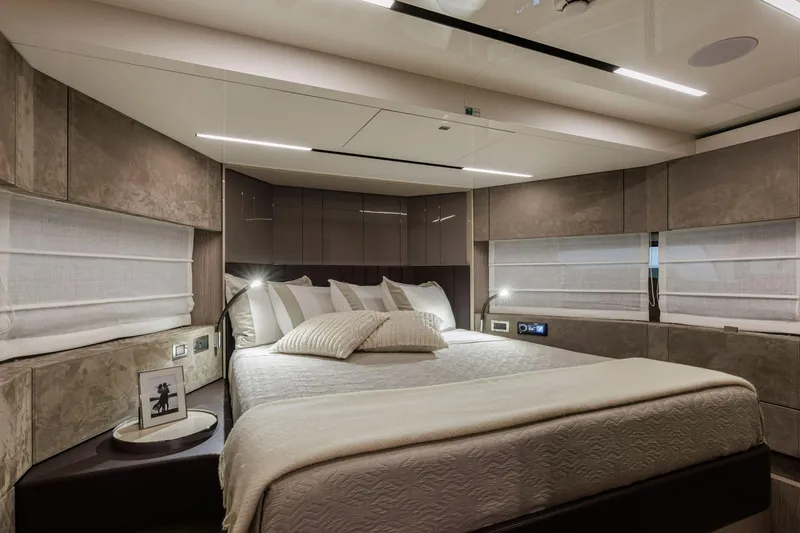 Slide: The Image of Luxurious bedroom interior of 2026 Cranchi Sessantasette 67 Corsa yacht, featuring modern design and ambient lighting. - 13