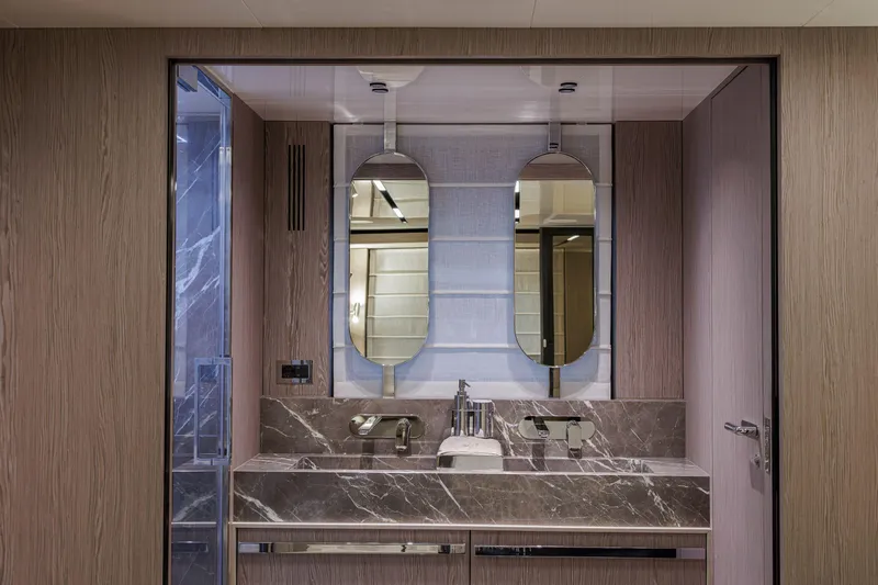 Slide: The Image of Luxurious bathroom interior of 2026 Cranchi Sessantasette 67 Corsa yacht with marble accents. - 15