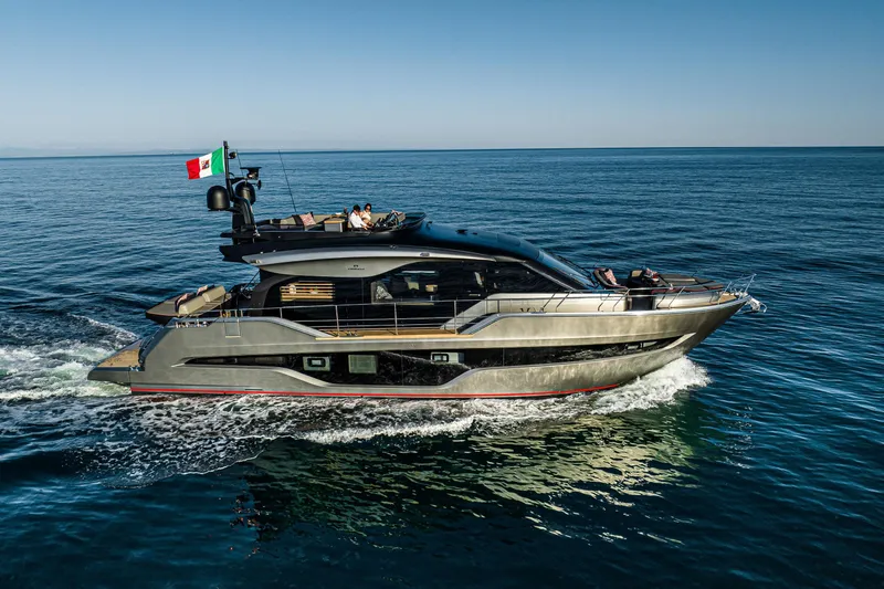 Slide: The Image of 2026 Cranchi Sessantasette 67 Corsa luxury yacht cruising on open sea. - 2