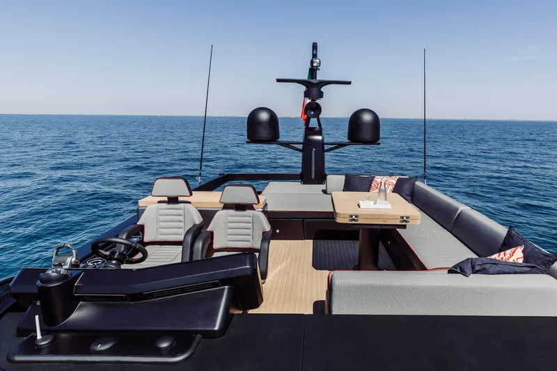 Slide: The Image of 2026 Cranchi Sessantasette 67 Corsa yacht interior with luxurious seating and ocean view. - 20