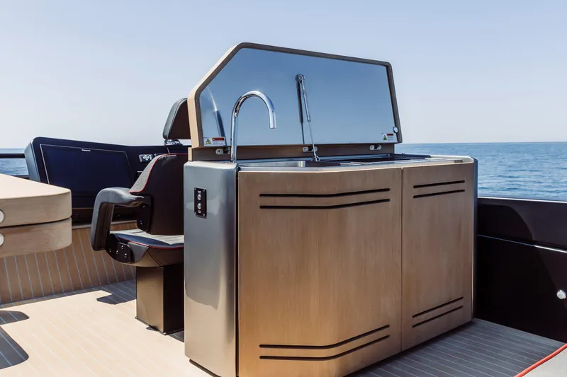 Slide: The Image of Luxury yacht Cranchi Sessantasette 67 Corsa 2026, featuring sleek outdoor kitchen design. - 21