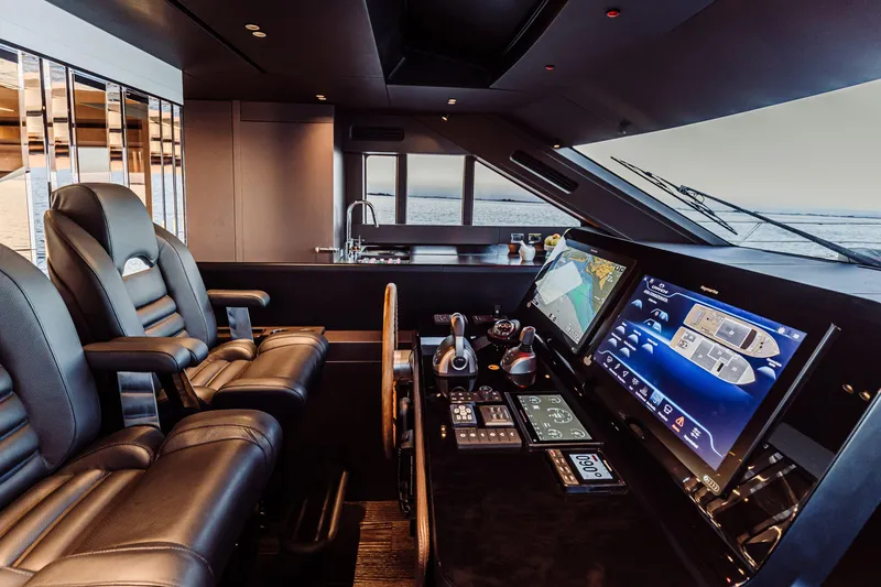 Slide: The Image of Luxurious 2026 Cranchi Sessantasette 67 Corsa yacht cockpit with advanced navigation systems. - 22