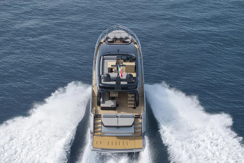 Slide: The Image of 2026 Cranchi Sessantasette 67 Corsa yacht cruising on open water. - 26