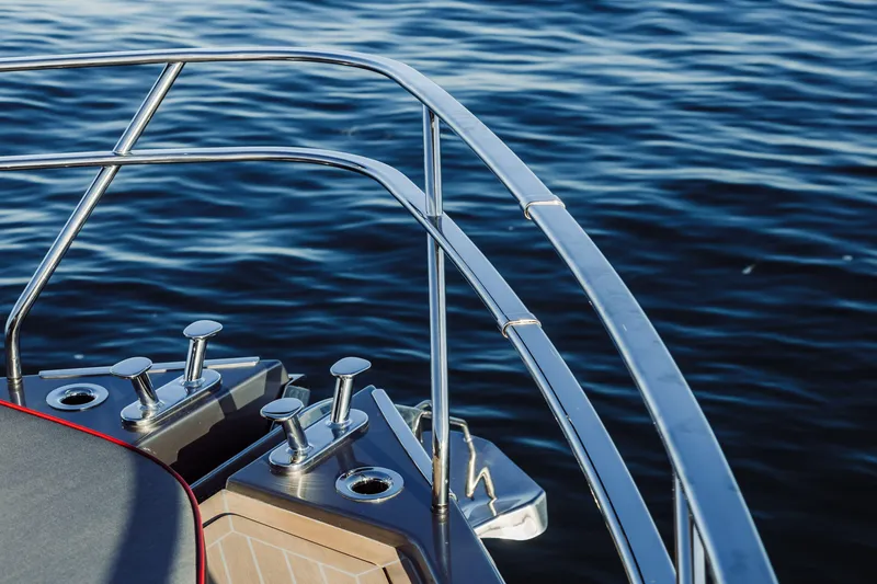 Slide: The Image of 2026 Cranchi Sessantasette 67 Corsa yacht deck with sleek railing and ocean view. - 31