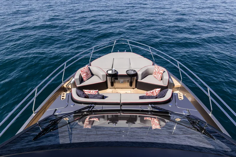 Slide: The Image of Luxurious 2026 Cranchi Sessantasette 67 Corsa yacht deck with elegant seating and ocean view. - 33