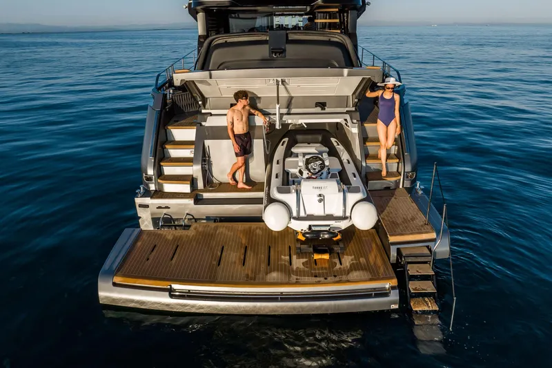 Slide: The Image of Luxury 2026 Cranchi Sessantasette 67 Corsa yacht with people enjoying the deck. - 38