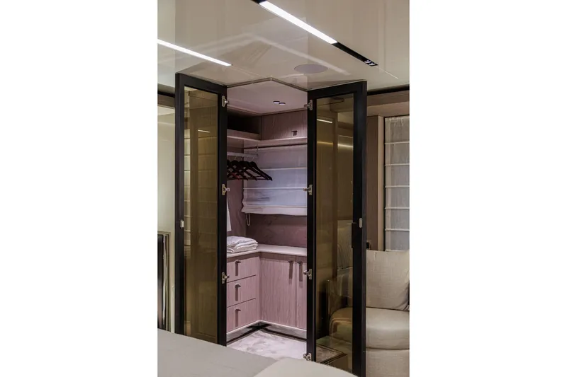Slide: The Image of Luxurious interior of 2026 Cranchi Sessantasette 67 Corsa yacht with elegant closet design. - 40