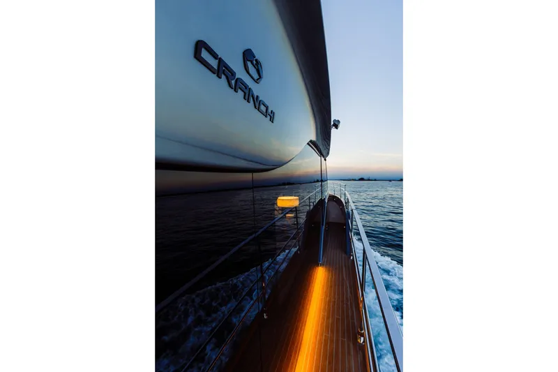 Slide: The Image of 2026 Cranchi Sessantasette 67 Corsa yacht cruising at sunset on open water. - 47