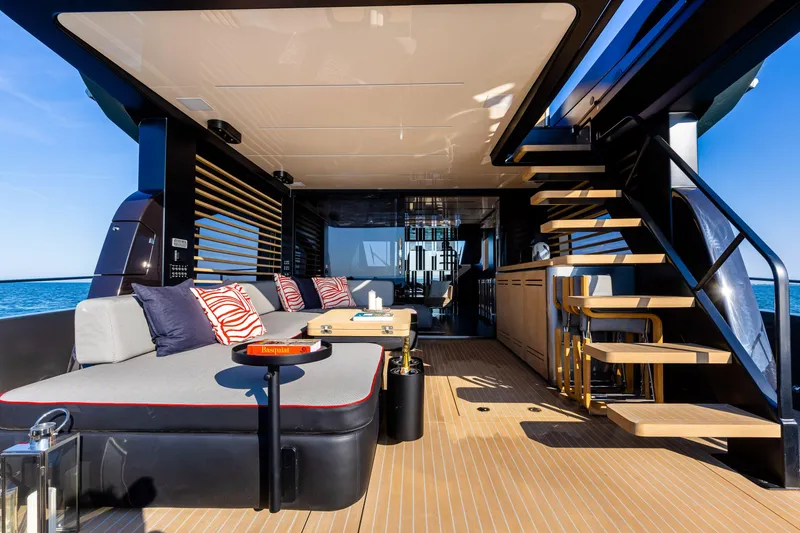 Slide: The Image of Luxurious 2026 Cranchi Sessantasette 67 Corsa yacht interior with modern seating and elegant design. - 48