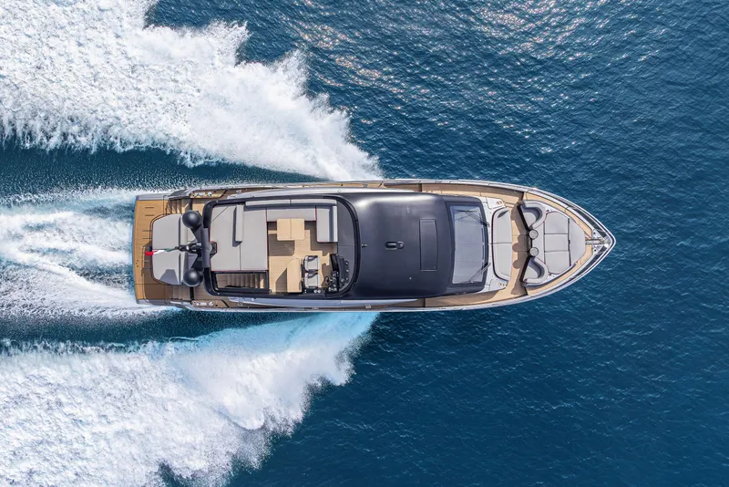 Slide: The Image of Aerial view of 2026 Cranchi Sessantasette 67 Corsa yacht cruising on blue ocean waters. - 6