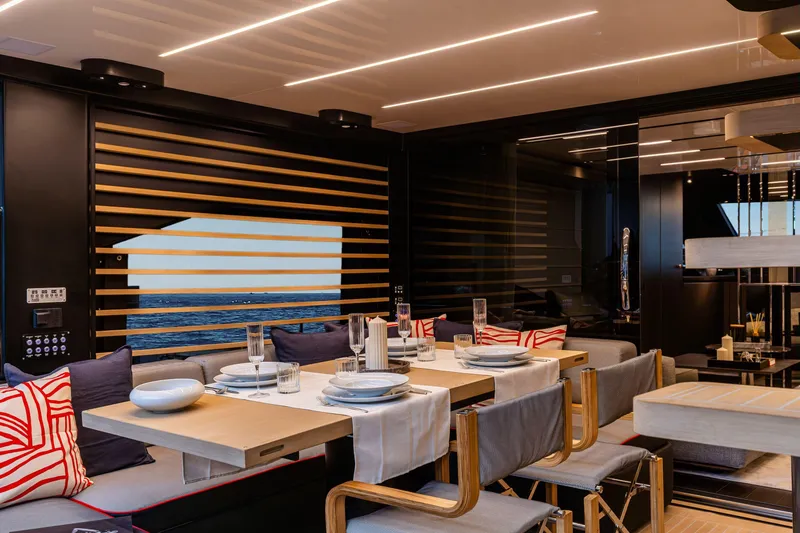 Slide: The Image of Luxurious dining area on 2026 Cranchi Sessantasette 67 Corsa yacht with elegant table setting. - 8