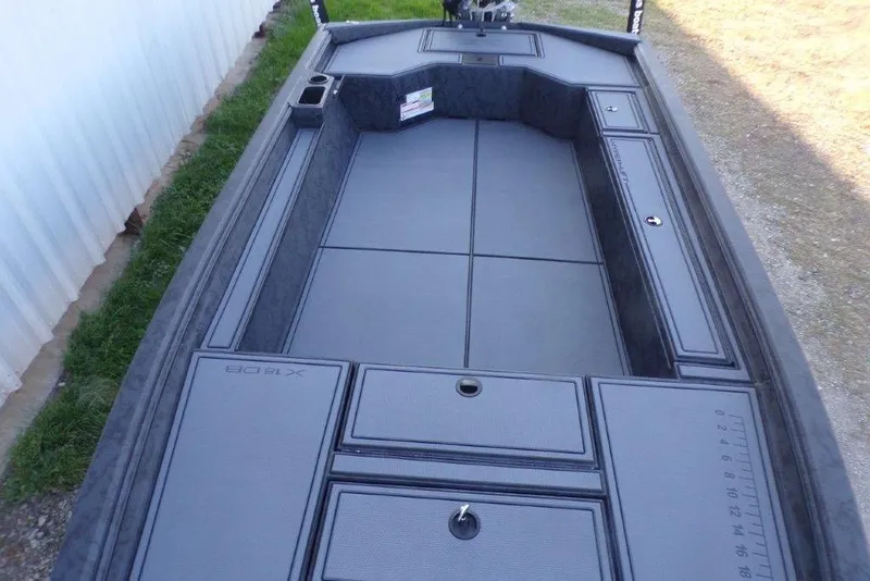 Slide: The Image of 2026 Xpress X18DB boat interior with spacious deck and storage compartments. - 17