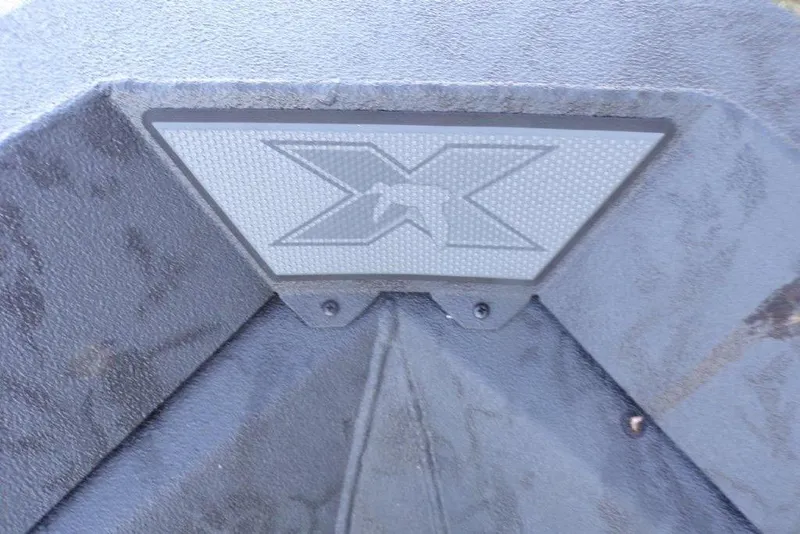 Slide: The Image of 2026 Xpress X18DB boat logo on textured surface. - 18