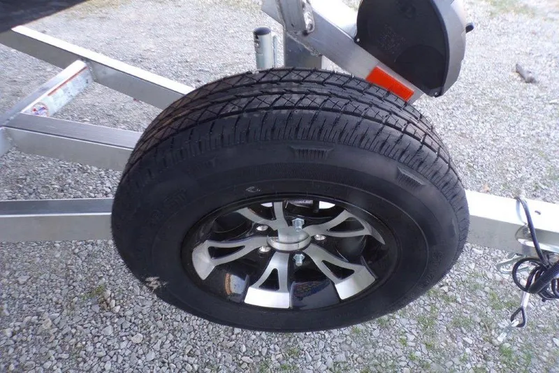 Slide: The Image of Trailer wheel of 2026 Xpress X18DB on gravel surface. - 21