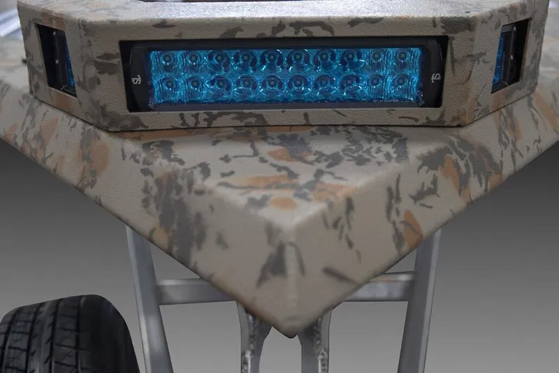 Slide: The Image of Manufacturer Provided Image: Camouflage-patterned Xpress X18DB 2026 boat with blue LED lights and trailer wheel. - 28