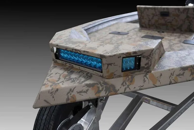 Slide: The Image of Manufacturer Provided Image: 2026 Xpress X18DB boat with camo design and blue LED lights. - 29
