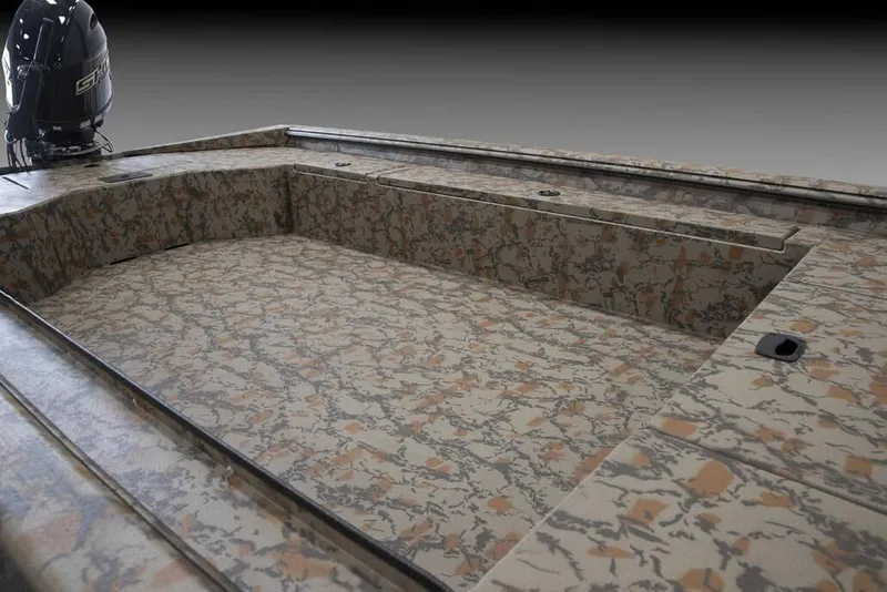 Slide: The Image of Manufacturer Provided Image: 2026 Xpress X18DB boat interior with camouflage design and outboard motor. - 31