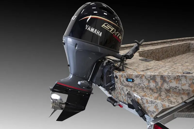 Slide: The Image of Manufacturer Provided Image: 2026 Xpress X18DB boat with Yamaha outboard motor, featuring camouflage design. - 35