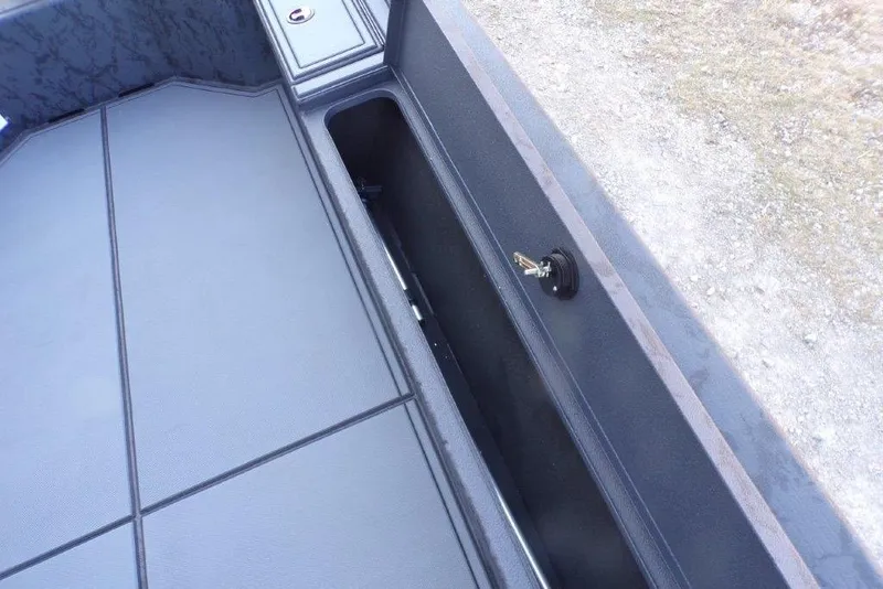 Slide: The Image of 2026 Xpress X18DB boat storage compartment with key lock, featuring sleek design and durable materials. - 4