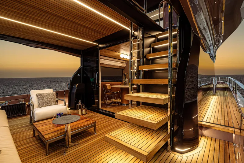 Slide: The Image of Luxurious 2026 Cranchi Sessantadue 62 yacht interior with elegant wooden deck at sunset. - 10